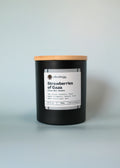 Candle with a wooden lid on a light gray background